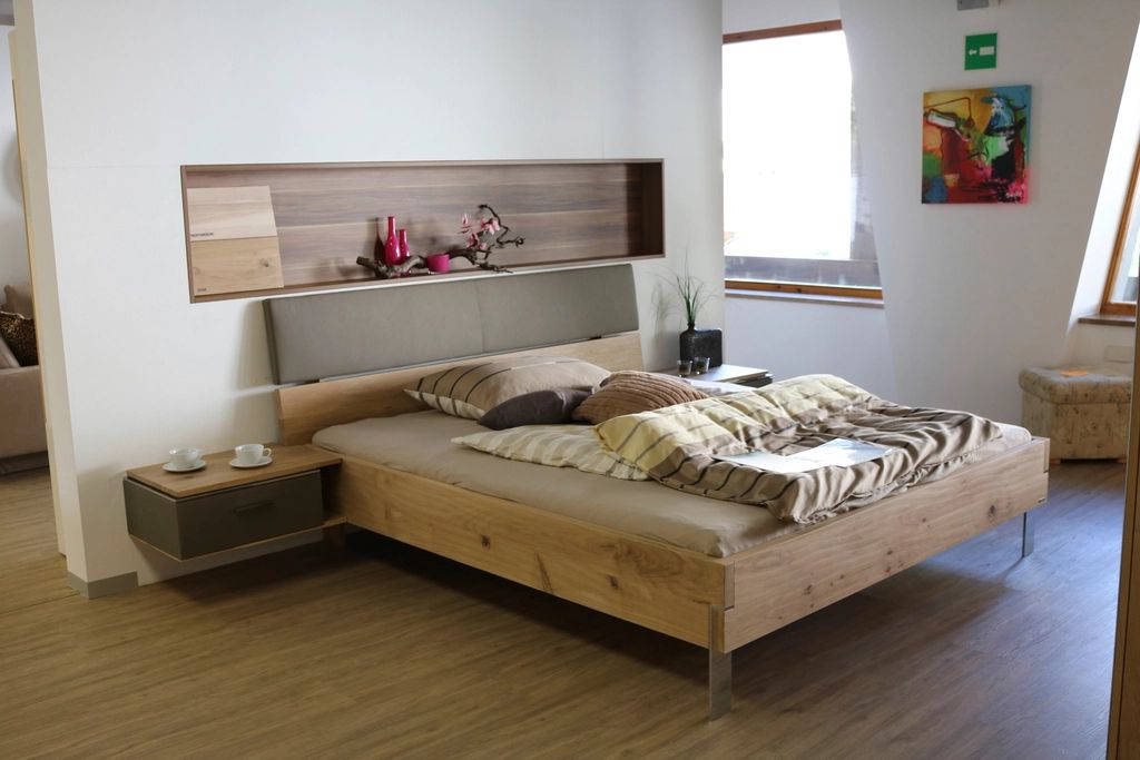 A guest room with two beds and a window